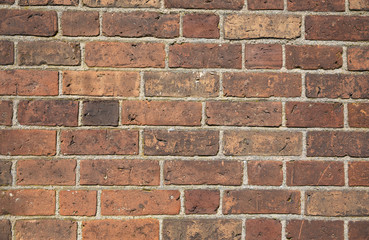 Old brick wall with many different colors of bricks as a background 