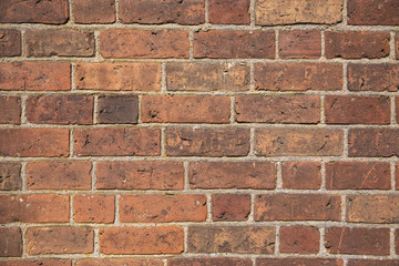 Old brick wall with many different colors of bricks as a background 