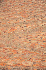 Old brick wall with many different colors of bricks as a background 