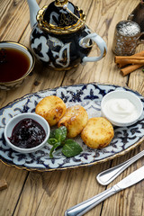 Pancakes on plate for breakfast with jam and spoon 