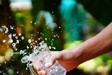 hand holding a bottle of water