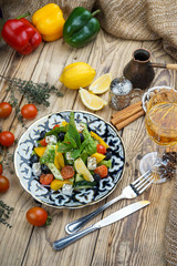 Salad from tomatoes, cucumber, red onions and lettuce leaves. healthy summer vitamin menu. vegan vegetable food. vegetarian dinner table. top view. flat lay