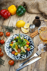Salad from tomatoes, cucumber, red onions and lettuce leaves. healthy summer vitamin menu. vegan vegetable food. vegetarian dinner table. top view. flat lay