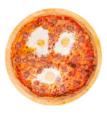 Whole pizza with beef sausages, eggs and bacon or Brunch pizza on a round wooden platter isolated on white background with clipping path, top view