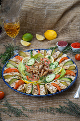 Shawarma from juicy beef, lettuce, tomatoes, cucumbers, paprika and onion in pita bread with spinach