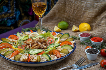 Shawarma from juicy beef, lettuce, tomatoes, cucumbers, paprika and onion in pita bread with spinach