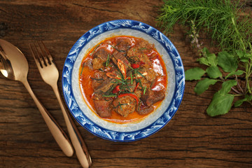 BEEF PANANG CURRY is popular Thai food. Beef curry with coconut milk, chili, and spicy herbs. Served with steam jasmine rice. Shoot in studio, Clean food good taste idea concept.