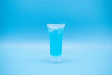 sanitizer gel pump dispenser. Clear sanitizer in pump bottle, for killing germs, bacteria and virus. isolate on Blue background.