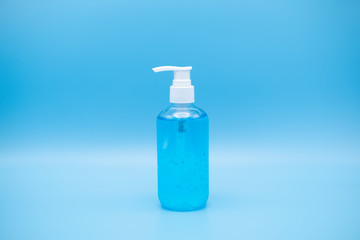 sanitizer gel pump dispenser. Clear sanitizer in pump bottle, for killing germs, bacteria and virus. isolate on Blue background.