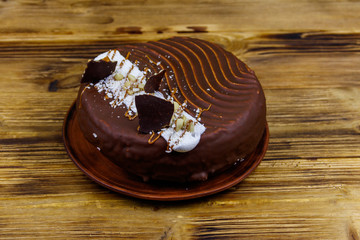 Tasty chocolate cake on a wooden table
