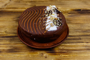 Tasty chocolate cake on a wooden table