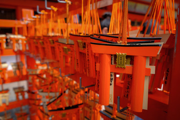 Fototapeta na wymiar Torii gates wishing Ema sign of Fushimi Inari Taisha Japan