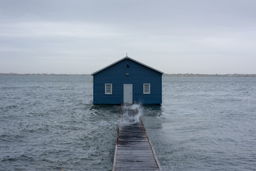 Blue Boat House, Crawley Edge Boat in the storm during Cyclone Mangga. Crawley, Swan River, Perth, Western Australia