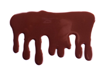Melted chocolate is dripping. Streams isolated on white.