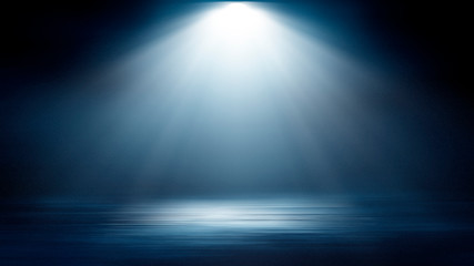 Wet asphalt, reflection of neon lights, a searchlight, smoke. Abstract light in a dark empty street with smoke, smog. Dark background scene of empty street, night view, night city.