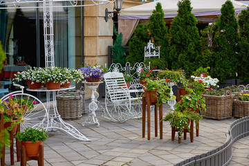 Russia, Kazan June 2019. Decorative stands in the old style and pots with flowers.