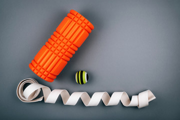Set of green myofascial release and massage ball, orange bumpy foam massage roller for trigger...