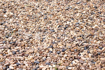 Small stone pavement texture or colorful gravel patterns background