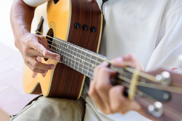 Fototapeta premium playing acoustic guitar in the park