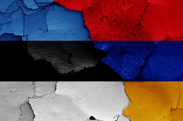 flags of Estonia and Armenia painted on cracked wall