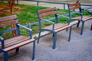 Three separate benches for relaxation. Distance between vacationers.