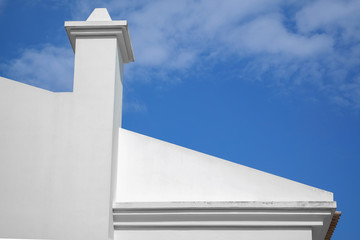 White chimney and the blue cloudy sky