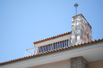 Chimney with ceramics and old roof