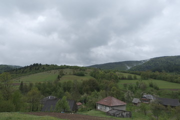 Spring forest mountains and sky with clouds. Copy space