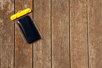 image of mobile phone silicon case wooden desk 