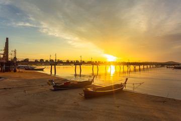 Obraz premium sunrise at Chalong pier. Chalong bay is the most important marina of Phuket there have 2 piers and customs at pier..