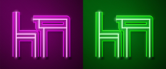 Glowing neon line School table and chair of classroom icon isolated on purple and green background. School desk. Vector Illustration