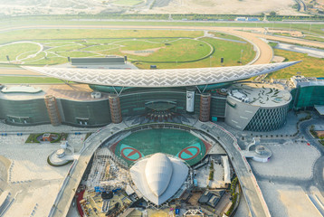 Aerial view of the Meydan racecourse complex during sunrise. Dubai, UAE.