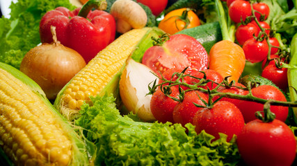 Closeup photo of big assortmentof fresh cut vegetables. Background for healthy food and GMO free products.Diet nutrition and fresh vegetables. Vegan and vegetarian background.