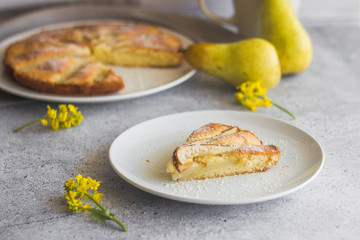 Delicious pear and almond pie. Romantic summer composition with flowers