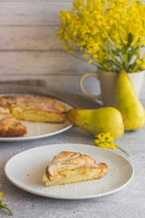 Delicious pear and almond pie. Romantic summer composition with flowers