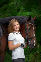 Obraz premium Beautiful young girl rider and her horse