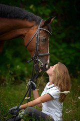 Fototapeta premium Beautiful young girl rider and her horse