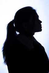 silhouette girl portrait on white isolated background, young woman in black clothes