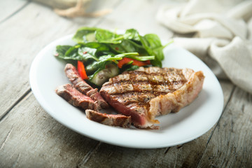 Grilled beef steak with salad