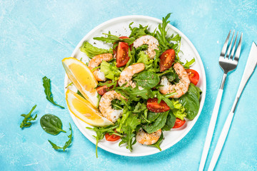 Shrimp salad with vegetables and leaves.