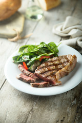 Grilled beef steak with salad