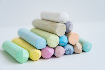 Colored crayons, stacked on top of each other, slide. Variety of color. Background, texture. Space for text