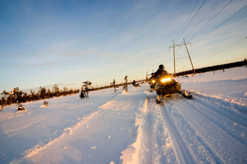 Finland 2006  : Some Snowmobile On The Snow At Sunset