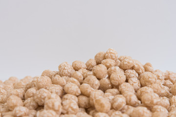 Balls for Breakfast, a side view. background texture. Beige shades.