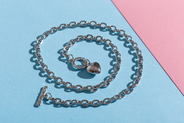 Top view of fashion jewelry and accessories on bright color background. Luxurious jewelry...
