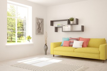 Fototapeta premium White living room with sofa and summer landscape in window. Scandinavian interior design. 3D illustration