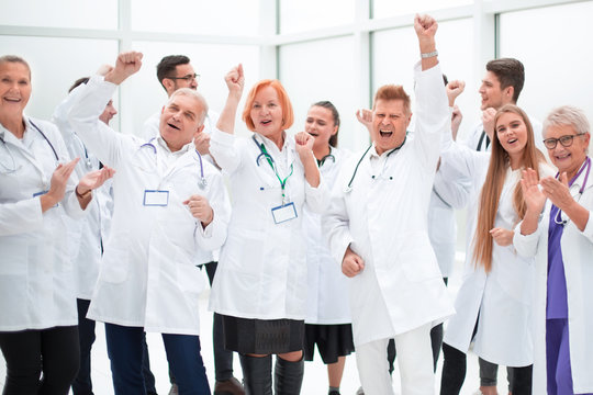 group of medical colleagues applauding their overall success.