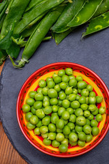 New harvest of ripe green peas legumes