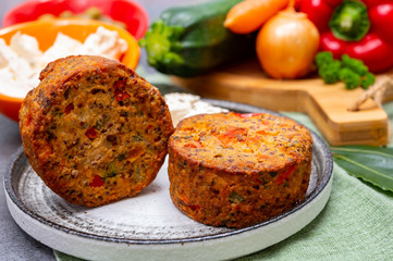 Tasty vegetarian food, burgers with Greek feta cheese, sweet red paprika, green olives and zucchini