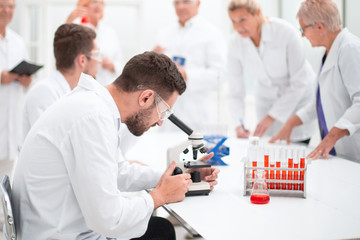 group of scientists working on a new vaccine.